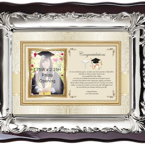 May include: A silver-plated picture frame with a mahogany wood backing. The frame has a 1.75 inch by 2.25 inch photo opening. The frame has a decorative design and a message that reads "Congratulations".