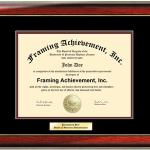 May include: A framed diploma with a maroon border and gold accents. The diploma is for John Doe, Master of Business Administration, from Framing Achievement, Inc. The diploma is dated March 1, 2012.