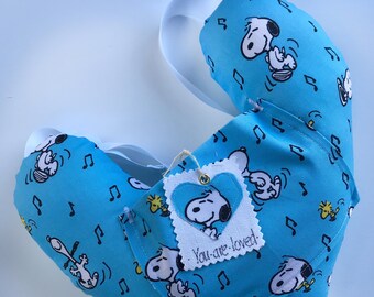 Dancing "Snoopy" mastectomy, post surgery comfort pillow with pocket adjusting straps and worn underarm.