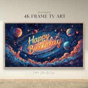 May include: A framed 4K TV art piece featuring a vibrant space-themed illustration. The artwork showcases planets, rockets, and a swirling galaxy with the words "Happy Birthday" in a stylized font. The color palette includes blues, oranges, and yellows.