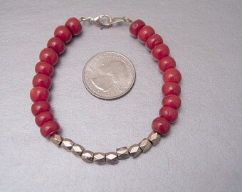 Red Dyed Bamboo Coral and Gold Metal Bead Bracelet