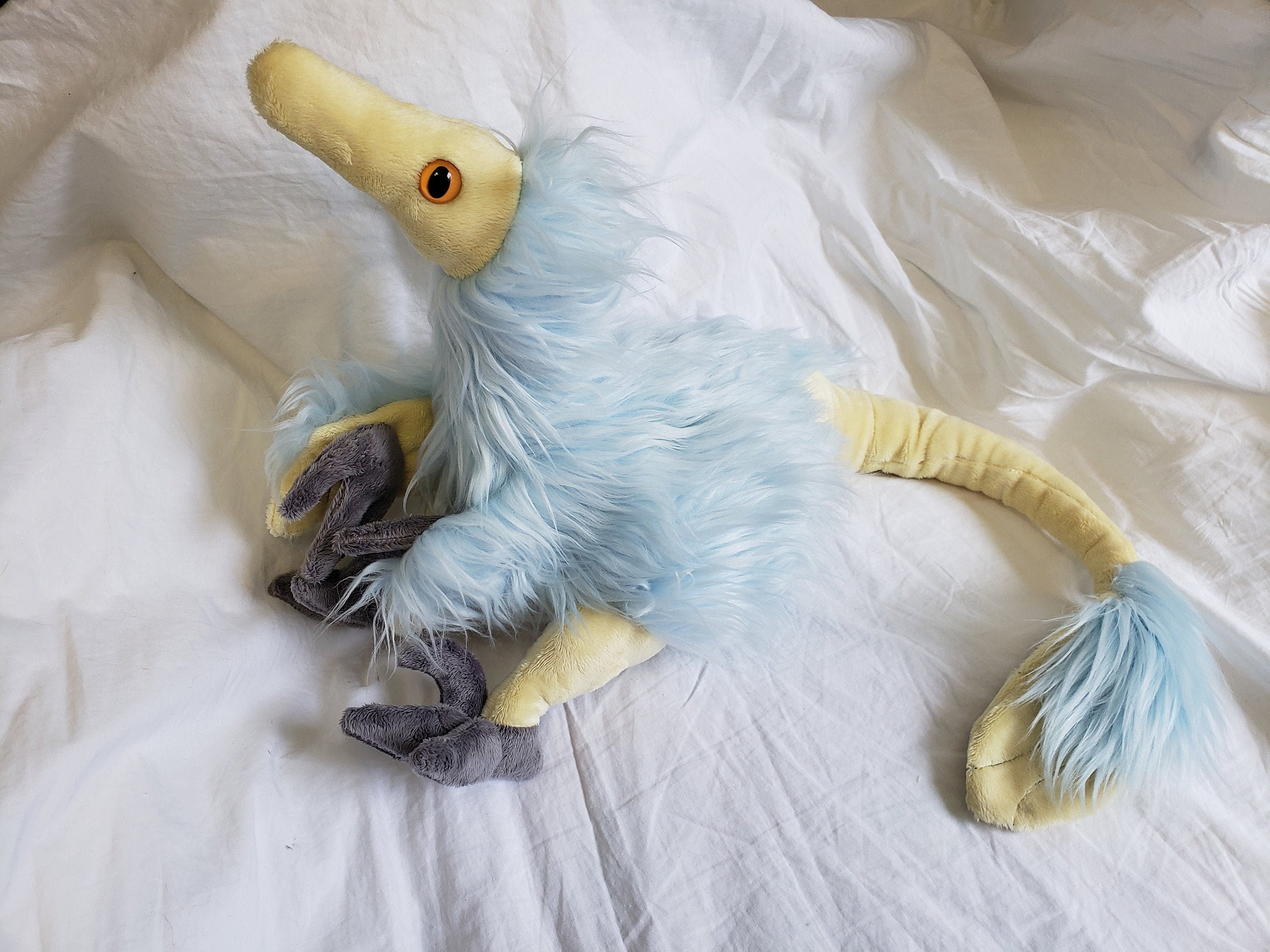 feathered velociraptor plush