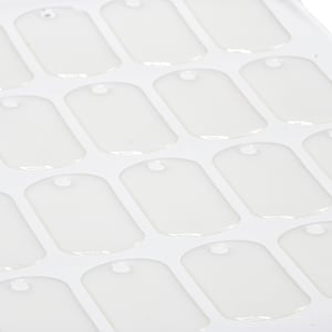 May include: A sheet of white plastic with multiple blank, round-cornered, dog tag shapes. Each tag has a small hole at the top.