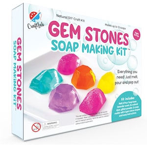 May include: A craft kit for making soap in the shape of gemstones. The kit includes soap base, scents, dyes, glitter, molds, and instructions. The box shows colorful soap gems in various shapes.