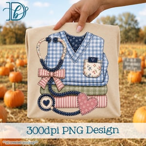 May include: A beige t-shirt featuring a graphic design of a blue and white gingham scrub top, a stethoscope with a pink striped bow, and a floral pocket. Below the scrub top are two stacked books with green and pink striped covers and a heart.
