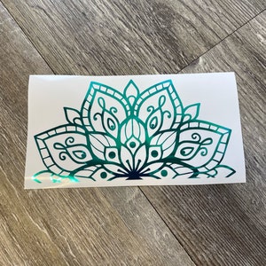 May include: A teal green mandala design with intricate details. The design is a half circle and has a gradient from dark teal to light teal.