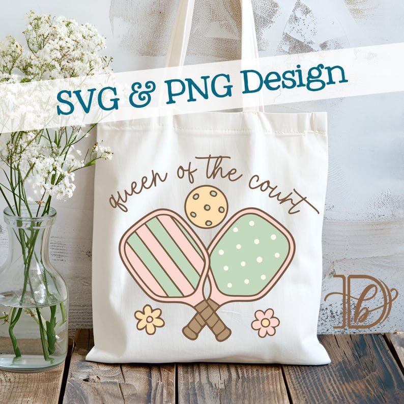 May include: Cream-colored tote bag featuring a pickleball design. The bag displays the text "Queen of the Court" with crossed pickleball paddles and a ball. The design includes pink, green, and brown accents, with the text "SVG & PNG Design" at the top.