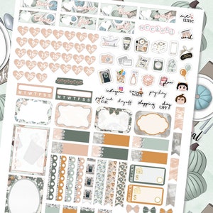 May include: A set of printable planner stickers with a fall theme. The stickers feature pumpkins, leaves, and other fall-themed designs. The stickers are in various colors, including orange, green, brown, and white. The stickers are perfect for adding a touch of fall to your planner.