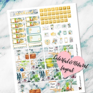 May include: A set of printable planner stickers featuring a green, blue, and gold color scheme. The stickers include a calendar, a weekly planner, and various decorative elements such as plants, furniture, and text. The text on the stickers includes "weekend", "Cozy Home", and "Colorful & Natural Layout".