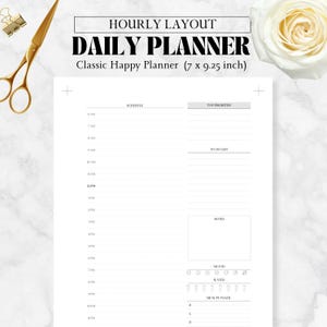 May include: A white daily planner with an hourly layout, designed for a Classic Happy Planner. The planner includes sections for scheduling, top priorities, to-do lists, notes, mood tracking, water intake, and meal planning. The planner measures 7 x 9.25 inches.