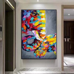 May include: Abstract painting of two elephants, one large and one small, with colourful, textured brushstrokes. The elephants are painted in shades of pink, yellow, blue, green, and white against a grey background.