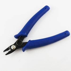 May include: Blue handled pliers with black metal jaws for jewellery making.