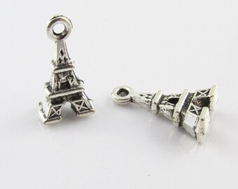 May include: Two silver Eiffel Tower charms with a loop at the top for attaching to jewelry or other crafts.