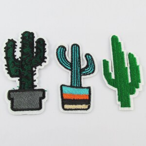 May include: Three embroidered cactus patches. One cactus is green with a grey pot, one is teal with an orange and black striped pot, and one is green with no pot.