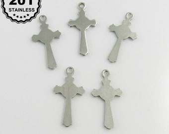 May include: Five silver-toned metal cross charms with a detailed design. The charms have a loop at the top for attaching to a necklace or bracelet.