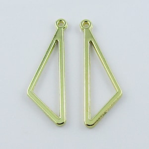 May include: Two gold-coloured metal triangle earring blanks with a loop at the top.