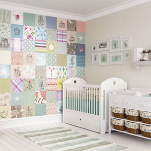 May include: A white cot with a white changing table and a colourful patchwork wall mural. The changing table has three drawers and a shelf with baskets. The cot has a white mattress and a white bumper.
