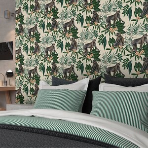May include: A white and green wallpaper with a repeating pattern of monkeys and tropical leaves. The monkeys are brown and sitting on branches. The leaves are green and have a variety of shapes.