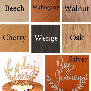 May include: A collage of wood samples with the names of different wood types: Beech, Mahogany, Walnut, Cherry, Wenge, Oak.  Two cake toppers are shown: one with the words "best day ever" in gold and the other with the words "Zac & Jennay" in silver.