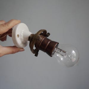 Angled wall lamp, porcelain base + E27 light bulb socket, brass shade holder, vintage architectural salvage for restoration