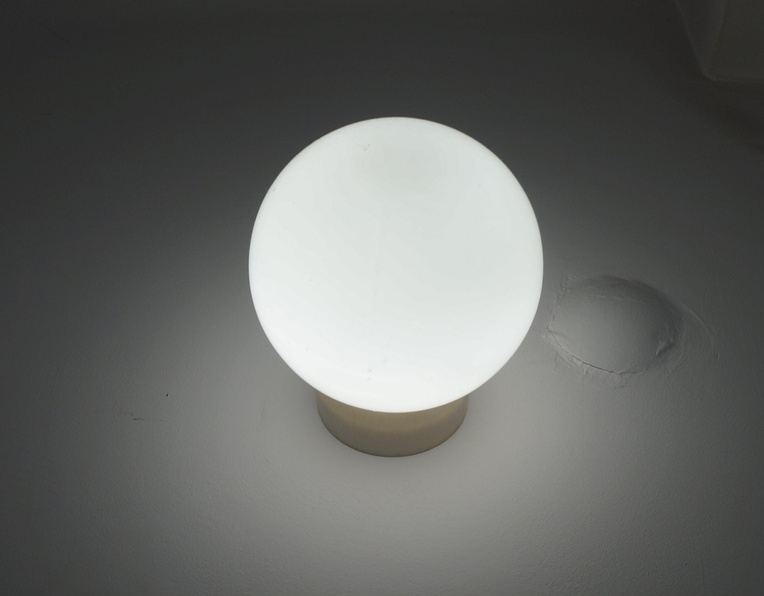 Industrial globe wall lamp, angled white porcelain base and milk white glass globe, vintage architectural salvage for restoration