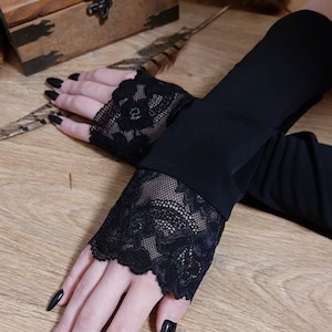 Black sleeves with lace. Long knitted mitts. Long sleeves. Muslim accessory.