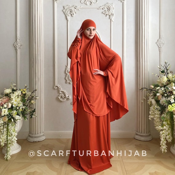 hijab with orange dress Orange dress with off white bag  || Hijab outfits