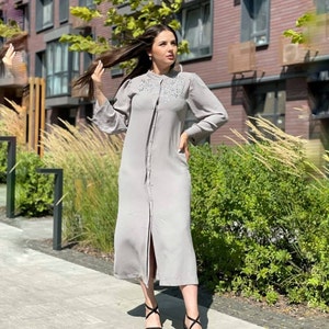Elegant light grey maxi dress with concealed button and chic details, modest abaya with stones, hijab formal outfit