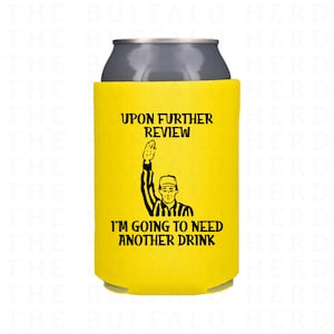 May include: Yellow can cooler with a black referee silhouette raising a flag and the text "Upon further review, I'm going to need another drink."