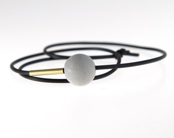 concrete brass statement bracelet black rubber cord / minimalistic contemporary architecture concrete jewelry