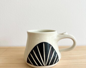 Handmade Pottery Coffee Mug: Sunrise Carved Design, 10oz Black and White Pottery Mug