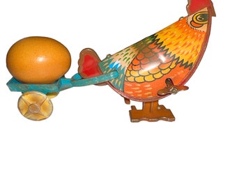 Vintage 80’s Russ Berrie Tin Litho Wind Up Hen Pulling Egg Easter Decoration Toy Works Well