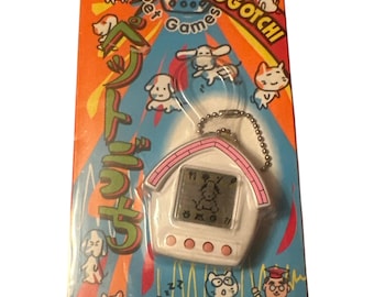 Vintage 90’s Petogotchi Rare Pet Games Pink White Dog Puppy House Electronic Raise A Pet Tamagotchi style Game New Old Stock On Card