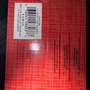 May include: Red box with a grid pattern. The box contains text that reads "TOY STORY 2 S&P SHAKERS" and "WASH ITEM THOROUGHLY BEFORE USE". There is a barcode and the text "CHINA".