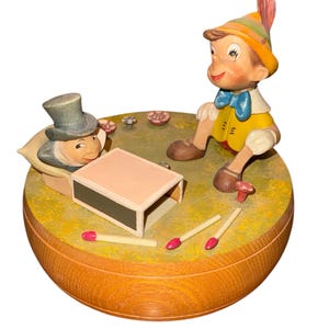 Vintage 70’s Disney ANRI Wood Carved Pinocchio Jimminy Cricket Matchbox Bed Hand Carved Painted 5x4” Spinning Reuge Music Box Made In Italy