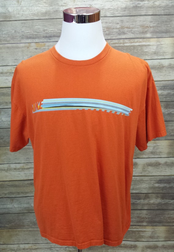 orange and gray nike shirt