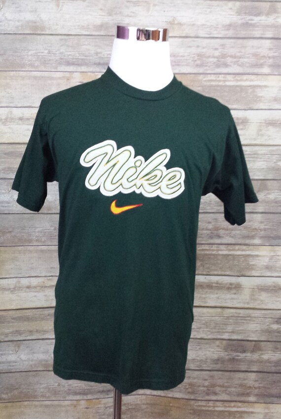 green and yellow nike shirt