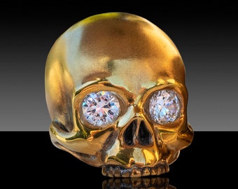 KEITH – An exact re-creation of KEITH RICHARDS skull in18Kt gold-plating with faux diamonds.