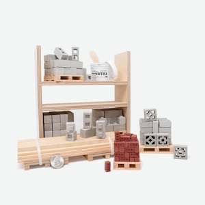 May include: A miniature construction set with a wooden shelf unit, a bucket of mortar, and various concrete blocks and bricks. The set includes a pallet of red bricks, a pallet of concrete blocks, and a pallet of decorative concrete blocks.