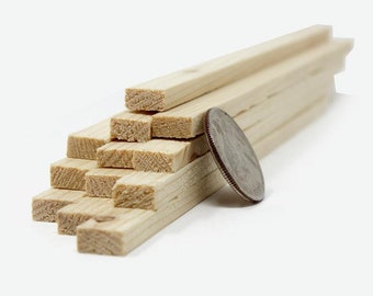 May include: A stack of 10 unfinished wooden craft sticks, approximately 1/4 inch thick, next to a US quarter for scale. The sticks are made of natural wood and are ready for painting or staining.