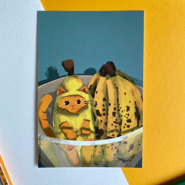 Cat in a banana suit in a bowl of bananas (Postcard / print)