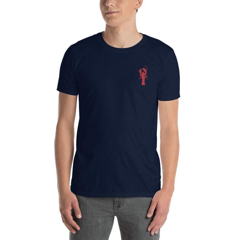 May include: A navy blue t-shirt with a red lobster graphic on the chest.