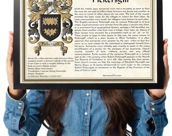 May include: A framed document titled The Family Name Pickersgill, featuring a heraldic coat of arms with a black shield, gold accents, and a magpie crest. The text provides historical information about the surname, its origin, and meaning.