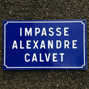May include: A blue street sign with white lettering that reads "Impasse Alexandre Calvet".