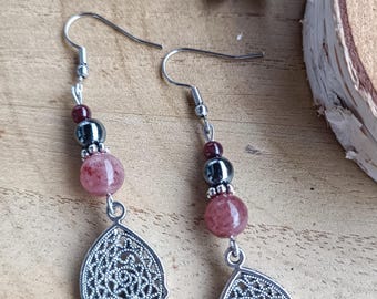 May include: A pair of silver filigree earrings with pink and gray gemstone beads and black beads.