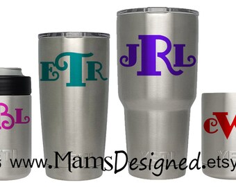 May include: Four stainless steel tumblers with personalized monograms. The tumblers are in different sizes and feature the monograms "MBL", "ETR", "JRL", and "cWe" in various colors.