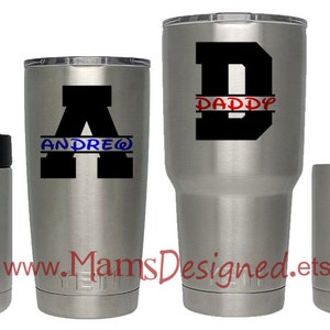 May include: Four stainless steel tumblers with personalized names and initial letters. The tumblers are in different sizes. The names are "Xavier", "Andrew", "Daddy", and "Papa".