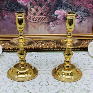 Set of two Baldwin Brass candle sticks.