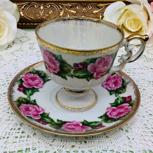 Japan pedestal hand painted teacup and saucer 1950’s.