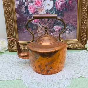 Large antique copper kettle.